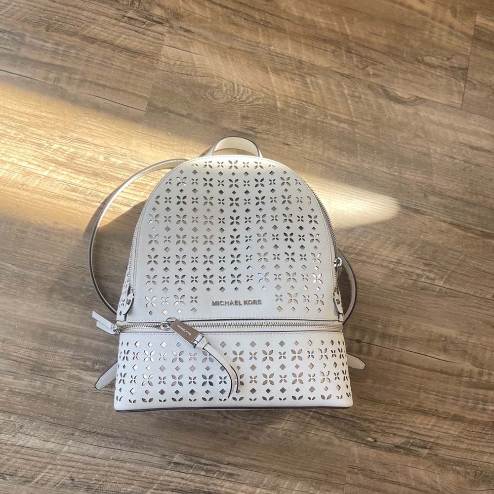 Michael Kors perforated Rhea back pack purse